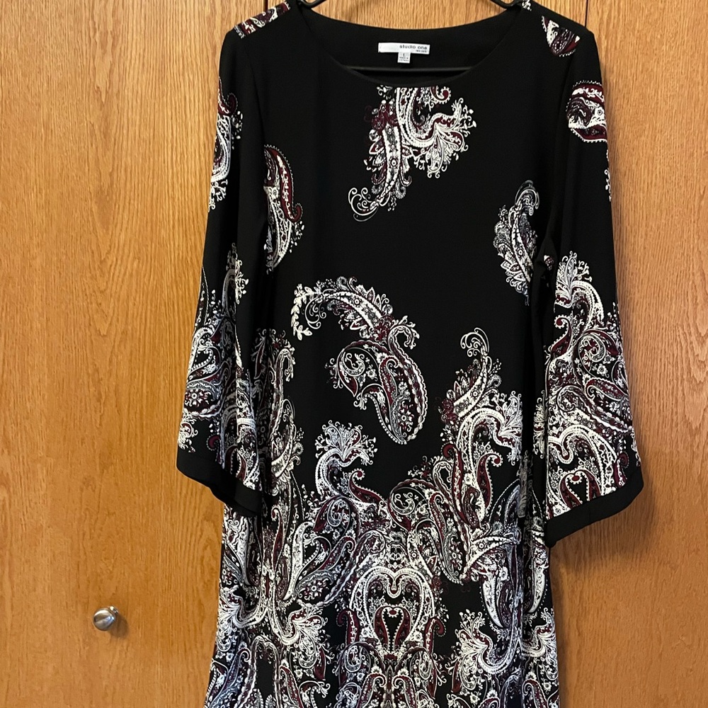 Black dress with white and burgundy decorative pattern
